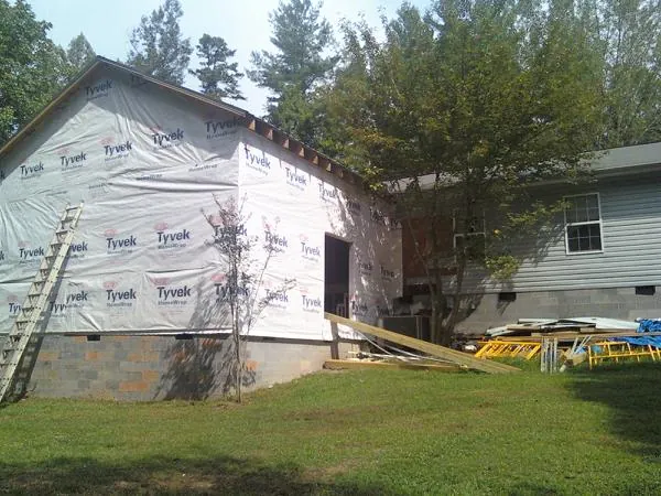 Tyvek wrapped gable on a new room addition beside an existing home in Princeton Junction